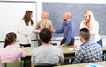 Professor chatting with students Royalty Free Stock Photo