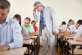 Professor with classroom full of students Royalty Free Stock Photo