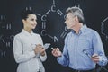 Professor Consultates Student About Chemistry. Royalty Free Stock Photo