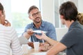 Professor distributing copies to students Royalty Free Stock Photo