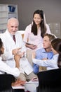 Professor having discussion with college students Royalty Free Stock Photo