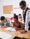 Teacher helping African-American schoolgirl Royalty Free Stock Photo