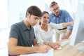 Professor helping students in class Royalty Free Stock Photo