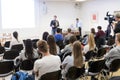 Professor lecturing in lecture hall at university.