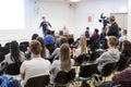 Professor lecturing in lecture hall at university.