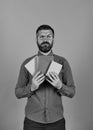 Professor with serious face. Man with beard and books Royalty Free Stock Photo