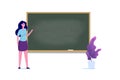 Professor or teacher standing near blank school blackboard. Royalty Free Stock Photo