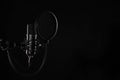 Proffesional studio microphone, isolated on the black background. Podcasts recording