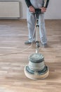 Proffesional worker cleans the floor Royalty Free Stock Photo