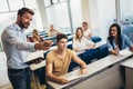 Proffesor giving presentation in lecture hall at university Royalty Free Stock Photo