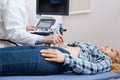 Proficient medical specialist having appointment in the sonography cabinet