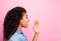 Profiel side photo of crazy amazed afro american girl hear unbelievable information want share novelty hold palm lips Royalty Free Stock Photo