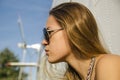 profile attractive girl with long hair in sunglasses about helicopter outside
