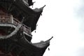 Detail of balcony and pointed wooden rooftops of a traditional Chinese pagoda Royalty Free Stock Photo