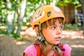 Profile of a beautiful eight year old girl in adventure park