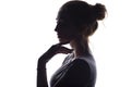 Profile of beautiful girl with hand-picked hair, silhouette of a woman on a white isolated background Royalty Free Stock Photo