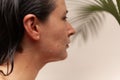 Profile of beautiful woman with water drops on her face