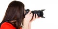 Profile brown hair woman photographer taking a photo isolated on white background in side view