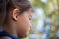 Profile child female face with bokeh background