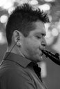 Close up of clarinetist Merlin Shepherd playing at an annual concert of Jewish Klezmer music in Regent`s Park in London UK. Royalty Free Stock Photo