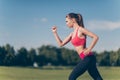 Profile cropped photo of young lady athlete, running outdoors, t