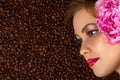 Profile face with peony on coffee beans Royalty Free Stock Photo