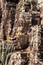 Profile of a face tower in the Bayon temple in Angkor. Cambodia. Vertical view Royalty Free Stock Photo