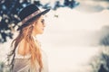 Profile of fashionable woman long hair with hat and sunglasses Royalty Free Stock Photo