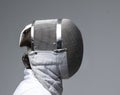 Profile of a fencer in fencing mask