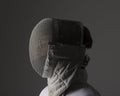 Profile of a fencer in fencing mask