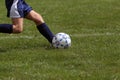 Profile of girl kicking soccer ball Royalty Free Stock Photo