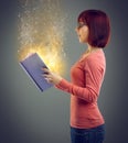 Profile, glowing book and woman with magic, story and education on grey studio background. Person, model and girl with Royalty Free Stock Photo