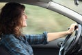Profile of a happy woman driving a car Royalty Free Stock Photo