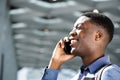 Profile of happy young african american man talking on cellphone Royalty Free Stock Photo