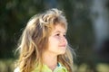 Profile kids face. Portrait of adorable little boy on green background park in nature. Wow look. Portrait of amazed cute