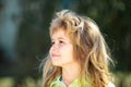 Profile kids face. Portrait of adorable little boy on green background park in nature. Wow look. Portrait of amazed cute