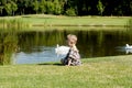 Profile of a little boy near a lake