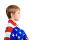 Profile of little patriot with American flag. Happy child holds a flag of America. Independence Day concept