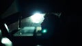 Profile of a man in car on dark night. Royalty Free Stock Photo