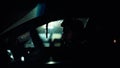 Profile of a man in car on dark night. Royalty Free Stock Photo