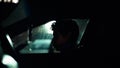 Profile of a man in car on dark night. Royalty Free Stock Photo