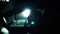 Profile of a man in car on dark night. Royalty Free Stock Photo