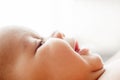 Profile of newborn baby smiling face, free space Royalty Free Stock Photo