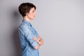 Profile photo of attractive business lady groomed wavy bobbed hairdo arms crossed self-confident chief worker look side