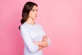 Profile photo of attractive pretty lady not smiling self-confident business woman arms crossed bossy look side empty Royalty Free Stock Photo