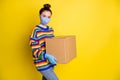 Profile photo of brunette girl hold huge box wear blue mask gloves from corona rainbow sweater pants isolated on bright Royalty Free Stock Photo