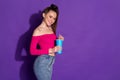 Profile photo of charming young lady hold cup straw empty space wear jeans pink uncovered shoulders top isolated violet