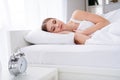 Profile photo of charming young lady lying sleeping bed white sheets blanket clothes calm sure metal alarm clock will