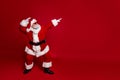 Profile photo of crazy entertainer old man dance empty space wear santa hat costume isolated red color background Royalty Free Stock Photo