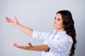 Profile photo of hopeful lady stretch hands catch empty space presents wear blue shirt isolated grey color background Royalty Free Stock Photo